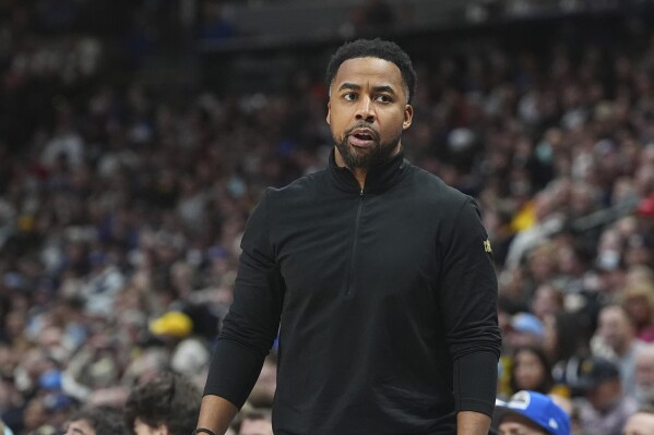 Cleveland Cavaliers assistant coach Johnnie Bryant in the second half of an NBA basketball game, Dec. 27, 2024, in Denver. (AP Photo/David Zalubowski)