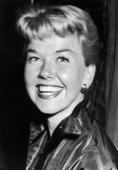 
              FILE - In this April 12, 1955 file photo, film actress and singer Doris Day smiles in London. Day, whose wholesome screen presence stood for a time of innocence in '60s films, has died, her foundation says. She was 97. The Doris Day Animal Foundation confirmed Day died early Monday, May 13, 2019, at her Carmel Valley, California, home. (AP Photo/Bob Dear, File)
            