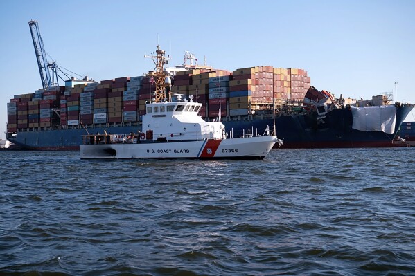 This image provided by the U.S. Coast Guard shows the U.S. Coast Guard Cutter Sailfish, an 87-foot Marine Protector class vessel, as it prepares to escort the Motor Vessel Dali during its transit from the Port of Baltimore to the Port of Virginia, Monday, June 24, 2024. (Petty Officer 3rd Class Christopher Bokum/U.S. Coast Guard via AP)