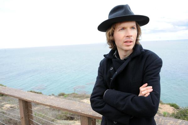 FILE - In this Dec. 14, 2012 file photo, musician Beck poses for a portrait at his home, in Malibu, Calif. Beck  Ed Sheeran, Sam Smith and the Electric Light Orchestra are among a new batch of performers added to the bill for Sunday night's Grammy Awards. The Grammys continue their signature of pairing artists for special one-time performances. Beck will take the stage with Coldplay's Chris Martin. (Photo by Katy Winn/Invision/AP, File)