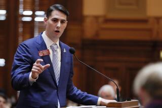 FILE - In this March 29, 2018, file photo, state Rep. Trey Kelley, R - Cedartown, presents HB 696, related to tax exemptions for computer equipment, which passed on the 40th and final day of the 2018 General Assembly session in Atlanta. Manfred Keais, the father of a bicyclist Eric Keais who died following a hit-and-run crash in Georgia has filed a wrongful death and civil rights lawsuit on Monday, Sept. 13, 2021, against the driver Ralph “Ryan” Dover III, as well as against a state House member Trey Kelley and Cedartown Police Chief Jamie Newsome, who the father says caused his son's death by not reporting it. (Bob Andres/Atlanta Journal-Constitution via AP)