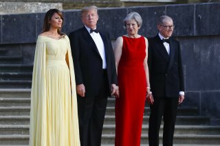               From left, first lady Melania Trump, President Donald Trump, British Prime Minister Theresa May, and her husband Philip May, watch the arrival ceremony at Blenheim Palace, Oxfordshire, Thursday, July 12, 2018. (AP Photo/Pablo Martinez Monsivais)
            