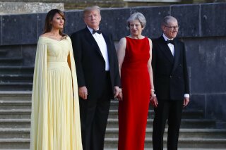 From left, first lady Melania Trump, President Donald Trump, British Prime Minister Theresa May, and her husband Philip May, watch the arrival ceremony at Blenheim Palace, Oxfordshire, Thursday, July 12, 2018. (AP Photo/Pablo Martinez Monsivais)