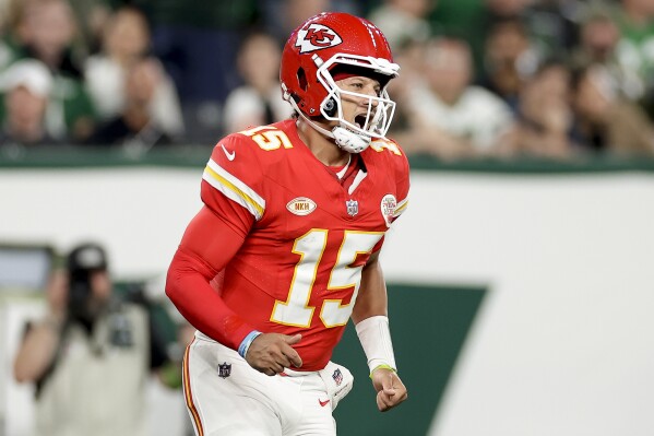 Kansas City Chiefs quarterback Patrick Mahomes (15) reacts after a touchdown against the New York Jets during the first quarter of an NFL football game, Sunday, Oct. 1, 2023, in East Rutherford, N.J. (AP Photo/Adam Hunger)
