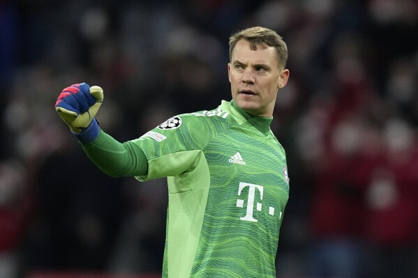 FILE - Bayern goalkeeper Manuel Neuer reacts during the Champions League, round of 16, second leg soccer match between Bayern and Salzburg in Munich, Germany, on March 8, 2022. Neuer has undergone an operation to remove metal implants from the leg he broke while skiing last season. Bayern said on Monday Aug. 7, 2023 the operation the day before was planned as part of Neuer's treatment. (AP Photo/Matthias Schrader, File)