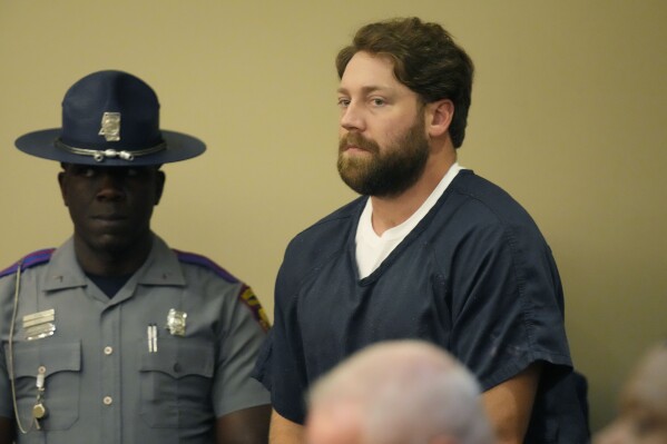 Former Rankin County sheriff’s deputy Hunter Elward, right, appears in the Rankin County Circuit Court in Brandon, Miss., Monday, Aug. 14, 2023. (AP Photo/Rogelio V. Solis)