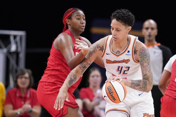 Phoenix Mercury's Brittney Griner (42) goes to the basket against Indiana Fever's Aliyah Boston, front left, during the second half of a WNBA basketball game, Sunday, June 11, 2023, in Indianapolis. (AP Photo/Darron Cummings)