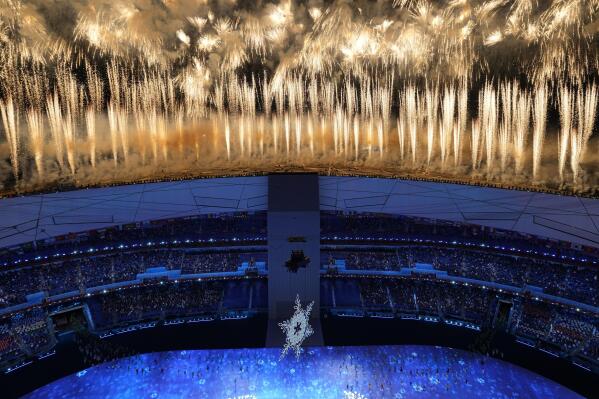 Fireworks light up the sky over Olympic Stadium during the opening ceremony of the 2022 Winter Olympics, Friday, Feb. 4, 2022, in Beijing. (AP Photo/Jeff Roberson)