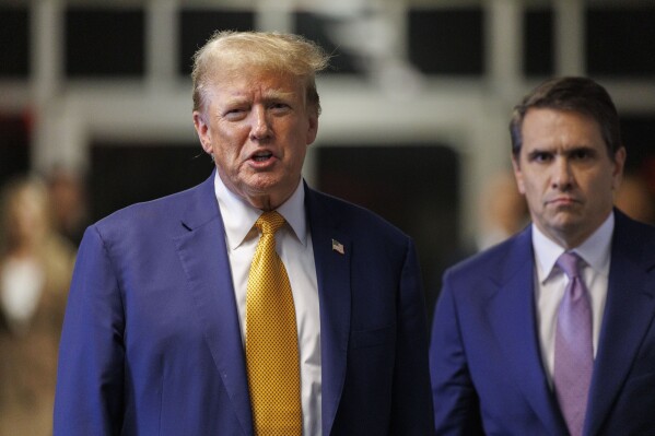 Former President Donald Trump, with his attorney Todd Blanche, speaks to reporters following the day's proceedings in his trial, Tuesday, May 7, 2024, in New York. (Sarah Yenesel/Pool Photo via AP)