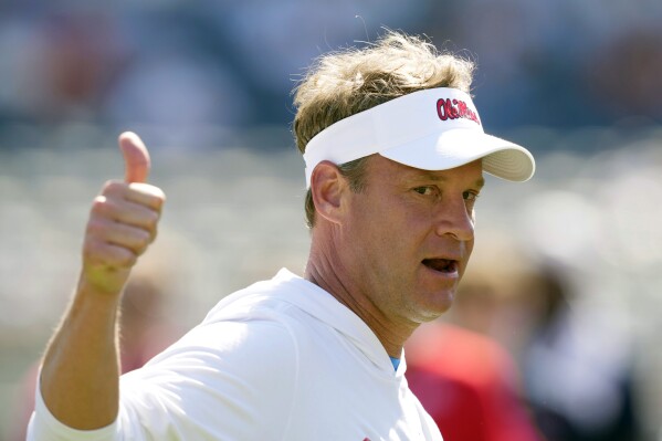 FILE - Mississippi coach Lane Kiffin shows his approval at his players efforts in a number of non-football events that were part of the the NCAA college football team's spring game, Saturday, April 13, 2024, in Oxford, Miss. The spring portal window in college football is closed. Kiffin lived up to the portal king moniker as the Rebels went all in. (AP Photo/Rogelio V. Solis, File)