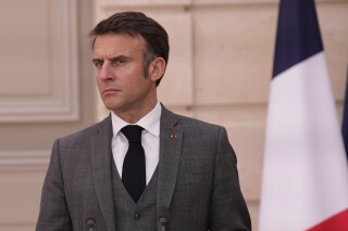 FILE - France's President Emmanuel Macron attend a media conference ahead of a working lunch with Moldova's President Maia Sandu at the Elysee Palace in Paris, Thursday March 7, 2024. French President Emmanuel Macron has announced new legislation to legalize “aid in dying” that will allow adults facing end-of-life illness to take lethal medication. (AP Photo/Christophe Ena, Pool, File)