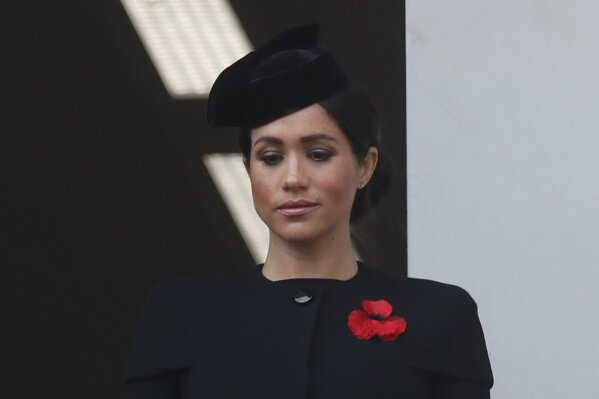 
              FILE - In this Nov. 11, 2018 file photo, Meghan Markle, Duchess of Sussex, attends the Remembrance Sunday ceremony at the Cenotaph in London. Meghan Markle’s father appealed to his daughter to call him, saying on Monday, Dec. 17, 2018, that they hadn’t been in touch since her wedding to Prince Harry in May. (AP Photo/Alastair Grant, File)
            