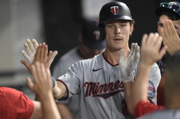 Minnesota Twins' Max Kepler celebrates with teammates in the dugout after hitting a solo home run during the third inning of the team's baseball game against the Chicago White Sox on Tuesday, July 5, 2022, in Chicago. (AP Photo/Paul Beaty)