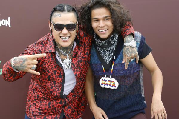 Sten Joddi, left, who plays Punkin Lusty, and D'Pharaoh Woon-A-Tai, who plays Bear, in the new series "Reservation Dogs,' pose for pictures during the premier of the show at Circle Cinema in Tulsa, Okla., Monday, Aug. 2, 2021. (John Clanton/Tulsa World via AP)