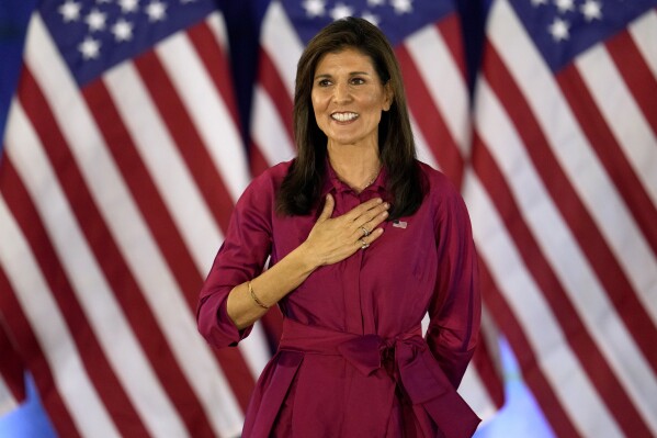 Republican presidential candidate former UN Ambassador Nikki Haley gestures to the audience as she concludes a speech at a caucus night party at the Marriott Hotel in West Des Moines, Iowa, Monday, Jan. 15, 2024. (AP Photo/Abbie Parr)