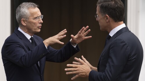 NATO Secretary General Jens Stoltenberg, left, and Dutch Prime Minister Mark Rutte, right, talk while waiting for other leaders to arrive in The Hague, Netherlands, Tuesday, June 27, 2023. Leaders of seven NATO allies met in the Netherlands with Secretary-General Stoltenberg for talks ahead of the alliance's summit in Lithuania next month. (AP Photo/Peter Dejong)