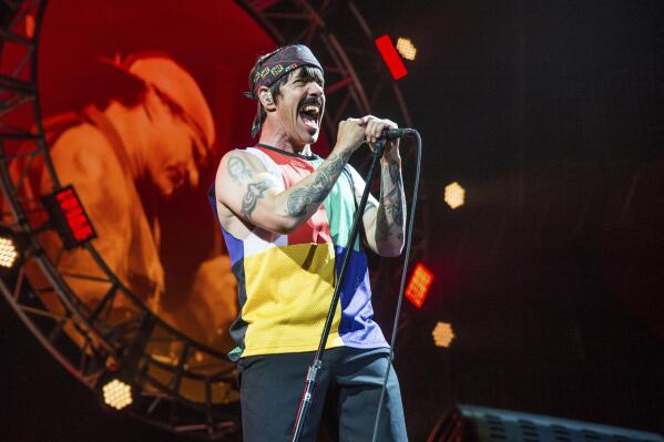 FILE - Anthony Kiedis of the Red Hot Chili Peppers performs at the Bonnaroo Music and Arts Festival on Saturday, June 10, 2017, in Manchester, Tenn. Organizers of this year's New Orleans Jazz Fest say the band Red Hot Chili Peppers has been added to the lineup of the 2022 event. The festival said Friday, April 8, 2022, that the appearance is set for Sunday, May 1, and will be the group's first performance at Jazz Fest since 2016. (Photo by Amy Harris/Invision/AP, File)