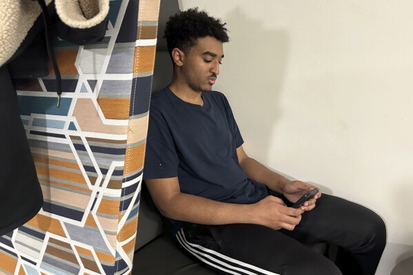 Mikael Makonnen, 18, a freshman at American University, poses for a photo in Washington, D.C, on Saturday, March 2, 2024, ĢӰԺ spoke with teenagers and young adults about their experiences on social media and what they wish they had known when they first got online. (ĢӰԺ Photo/Almaz Abedje)