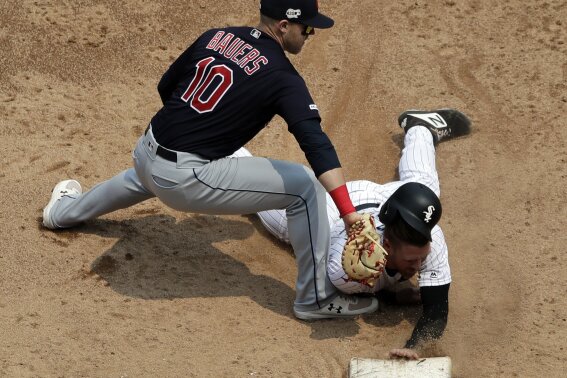Chicago White Sox's Charlie Tilson, right, is tagged out at first base by Cleveland Indians first baseman Jake Bauers on a pick-off during the third inning of a baseball game in Chicago, Saturday, June 1, 2019. (AP Photo/Nam Y. Huh)
