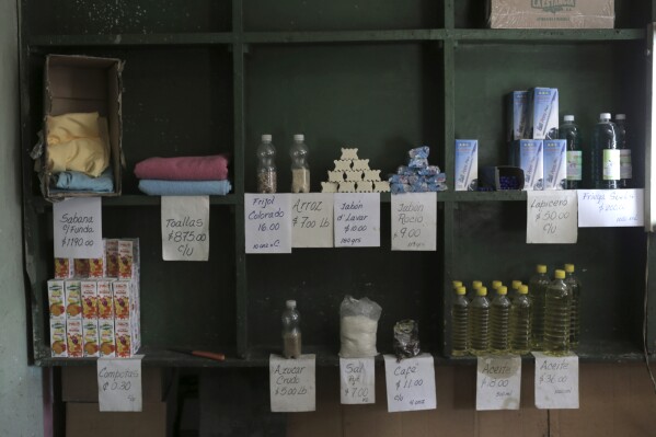 Products are displayed on a shelf in a government subsidized store where goods can only be purchased with a government ration book known as a “libreta,” in Havana, Cuba, Tuesday, March 12, 2024. The “libreta,” was launched in July 1963 and became one of the pillars of the island’s socialist system, helping people through crises including the cutbacks in Soviet aid that led to the 1990s deprivation known as the “Special Period.” (AP Photo/Ariel Ley)