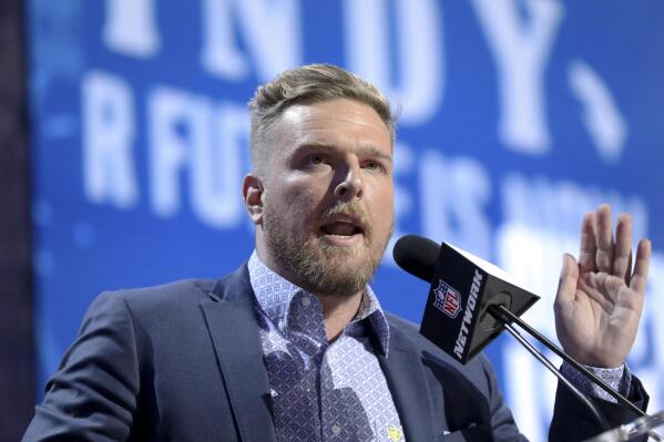 FILE - Former Indianapolis Colts player Pat McAfee announces the Colts' third round pick at the NFL football draft, April 26, 2019, in Nashville, Tenn. Retired NFL quarterback Brett Favre is dismissing his lawsuit against McAfee after McAfee publicly apologized for his previous on-air statements that Favre had been “stealing from poor people in Mississippi” in a welfare misspending case. Favre and McAfee both announced the settlement Thursday, May 11, 2023. (AP Photo/Gregory Payan, File)