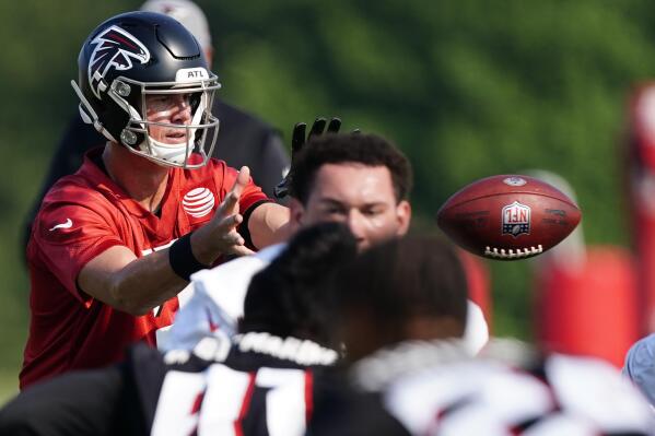Atlanta Falcons quarterback Matt Ryan catches the snap during the team's NFL training camp football practice in Flowery Branch, Ga. Thursday, July 29, 2021. (AP Photo/ John Bazemore)