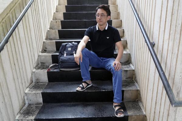 Miao Yu takes a break between classes at the west campus of Valencia College, Monday, Jan. 30, 2023, in Orlando, Fla. Yu, a former bookseller, left China after his store was shut down for political reasons. (AP Photo/John Raoux)