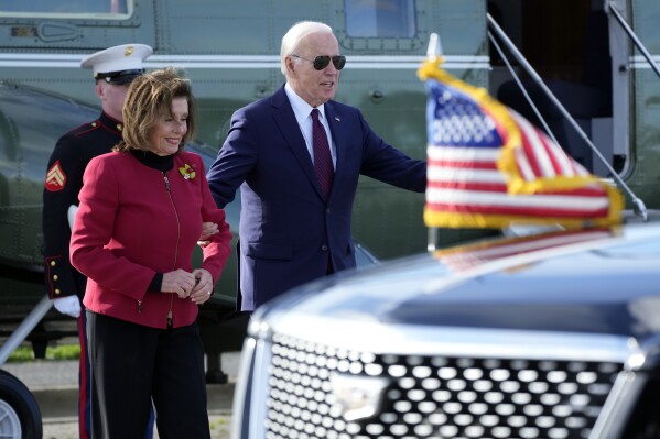 President Joe Biden escorts Rep. Nancy Pelosi, D-Calif., from Marine One to attend a fundraiser in San Francisco, Wednesday, Feb. 21, 2024. (APPhoto/Manuel Balce Ceneta)