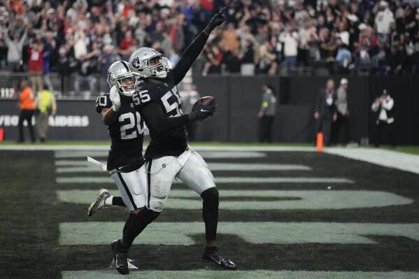 Las Vegas Raiders defensive end Chandler Jones (55) celebrates after scoring on an interception during the second half of an NFL football game between the New England Patriots and Las Vegas Raiders, Sunday, Dec. 18, 2022, in Las Vegas. The Raiders defeated the Patriots 30-24. (AP Photo/John Locher)