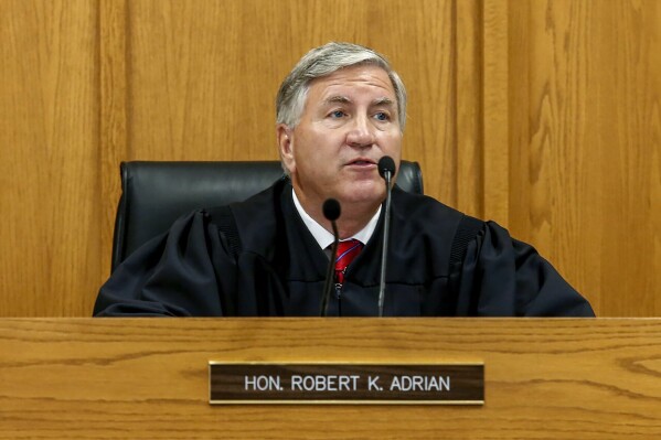 FILE - Judge Robert Adrian presides over court on Aug. 26, 2020, in Adams County, Ill. Adrian could face removal from office after a judicial oversight body considered allegations this week, Wednesday, Nov. 8, 2023 that he circumvented the law when he decided to reverse a rape conviction in a move that sparked outrage in the victim’s hometown of Quincy, Illinois, and beyond. (Jake Shane/Quincy Herald-Whig via AP, File)