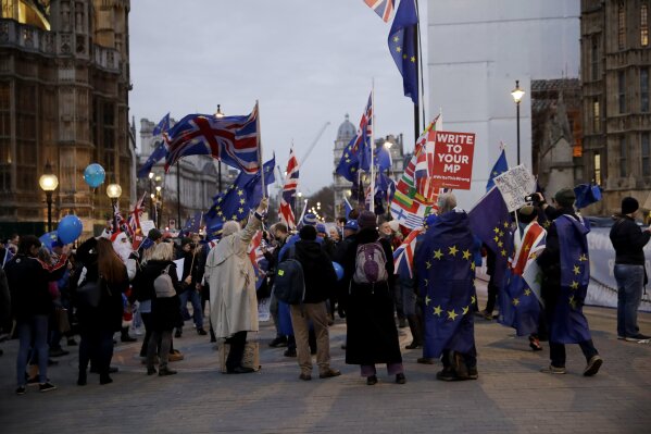 
              Remain, anti-Brexit supporters take part in a protest across the street from the Houses of Parliament in London, Monday, Dec. 10, 2018. British Prime Minister Theresa May has postponed Parliament's vote on her European Union divorce deal to avoid a shattering defeat — a decision that throws her Brexit plans into chaos.(AP Photo/Matt Dunham)
            