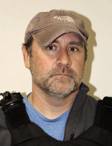 This photo released by the Louisville (Kentucky) Police shows Louisville Police Det. Myles Cosgrove after a narcotics raid on March 13, 2020. The former Louisville police officer who fatally shot Breonna Taylor has a new job in law enforcement in a county northeast of the city. WHAS-TV reports that the Carroll County Sheriff’s Office has hired Myles Cosgrove. Activists announced a protest in response Monday, April 24, 2023 at the small sheriff's department. Taylor was killed in March 2020 when police used a faulty drug warrant to break through her door. (Louisville Police via AP)
