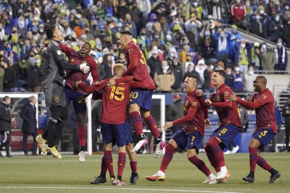 Real Salt Lake players react after defeating the Seattle Sounders during a penalty-kick shootout in an MLS first-round playoff soccer match Tuesday, Nov. 23, 2021, in Seattle. Real Salt Lake won 6-5. (AP Photo/Ted S. Warren)