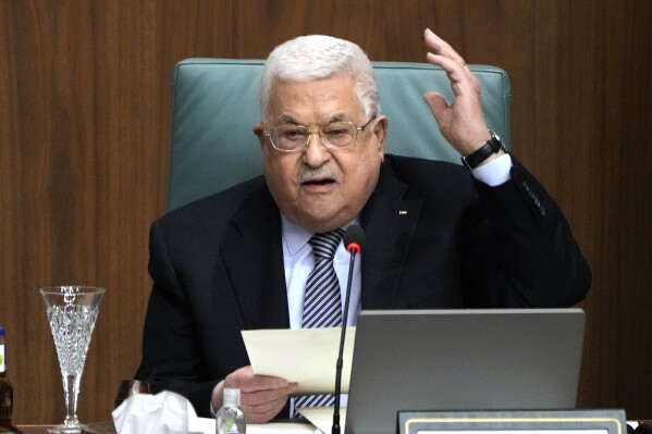 FILE - Palestinian President Mahmoud Abbas speaks during a conference to support Jerusalem at the Arab League headquarters in Cairo, Egypt, on Feb. 12, 2023. Palestinian President Mahmoud Abbas has fired most of the governors in the occupied West Bank. The move follows long-standing demands for a political shake-up as frustration grows with the semi-autonomous Palestinian Authority. Abbas issued a decree dismissing the governors of eight provinces under Palestinian administration in the occupied territory. (AP Photo/Amr Nabil, File)