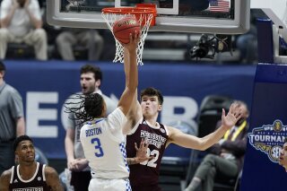 Kentucky's Brandon Boston Jr. (3) shoots against Mississippi State's Quinten Post (32) in the first half of an NCAA college basketball game in the Southeastern Conference Tournament Thursday, March 11, 2021, in Nashville, Tenn. (AP Photo/Mark Humphrey)