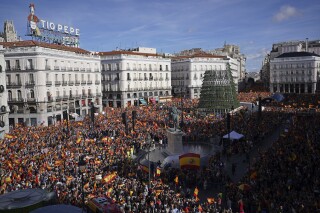 FILE - Crowds with Spanish flags pack the central Puerta del Sol during a protest called by Spain's Conservative Popular Party in Madrid, Spain, Sunday Nov.12, 2023. A video of the demonstration is being misrepresented online as a response to the latest Israel-Hamas war. (AP Photo/Joan Mateu Parra, File)