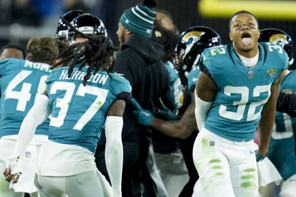 The Jacksonville Jaguars celebrate his game-winning field goal against the Los Angeles Chargers during the second of an NFL wild-card football game, Saturday, Jan. 14, 2023, in Jacksonville, Fla. Jacksonville Jaguars won 31-30. (AP Photo/John Raoux)