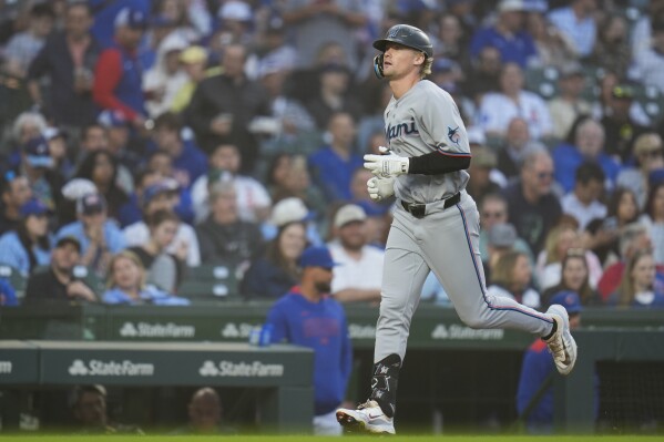 Miami Marlins' Kyle Stowers (28) runs the bases after hititng a home run during the fourth inning of a baseball game against the Chicago Cubs, Wednesday, May 14, 2025, in Chicago. (AP Photo/Erin Hooley)