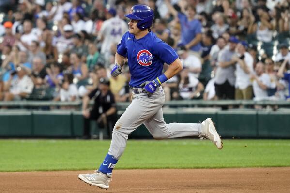 Chicago Cubs' Patrick Wisdom runs the bases after hitting a solo home run during the fourth inning of the team's baseball game against the Chicago White Sox in Chicago, Saturday, Aug. 28, 2021. (AP Photo/Nam Y. Huh)