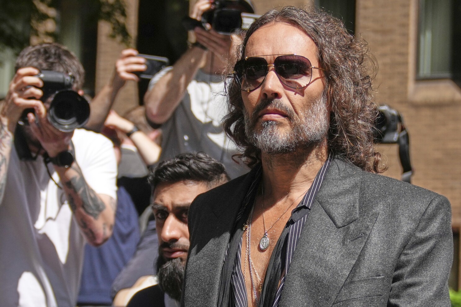 Russell Brand pleads not guilty to charges of rape and sexual assault