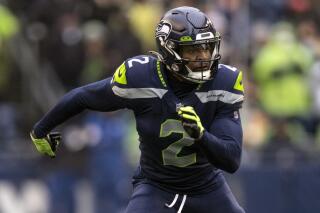 FILE - Seattle Seahawks defensive back D.J. Reed chases a play during an NFL football game against the Detroit Lions, on Jan. 2, 2022, in Seattle. The New York Jets are signing former Seahawks cornerback D.J. Reed, according to a person with direct knowledge of the move. The person confirmed the agreement to The Associated Press on condition of anonymity on Tuesday, March 15, 2022, because the team had not announced it; deals are not made official until the NFL's league year begins Wednesday. (AP Photo/Stephen Brashear, File)