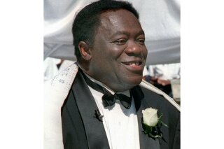 FILE - Actor Yaphet Kotto appears on his wedding day in Baltimore, Md. on July 12, 1998. Kotto, the commanding actor of the James Bond film “Live and Let Die” and as Lt. Al Giardello on the 90's NBC police drama "Homicide: Life on the Street, died Monday, March 15, 2021 at age 81. Kotto’s wife, Tessie Sinahon, announced his death Monday in a Facebook post. She said he died Monday in the Philippines. Kotto's agent, Ryan Goldhar, confirmed Kotto's death. (AP Photo/John Gillis, File)