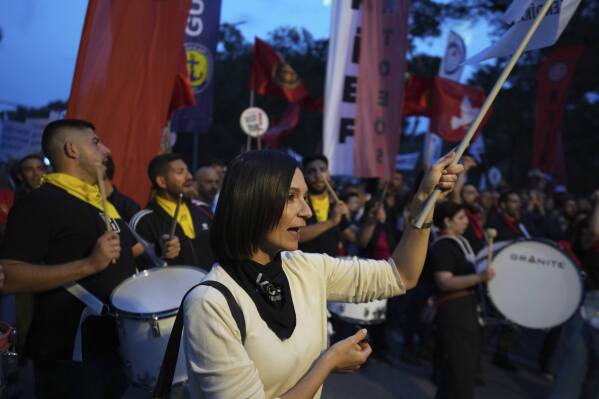 Several thousand Turkish Cypriots took to the streets of the northern half of ethnically divided Cyprus' capital Nicosia to protest what they say is Turkey's attempt to erode their secular roots and to strengthen the hold of political Islam over their society, on Friday, May 2, 2025. (AP Photo/Petros Karadjias)