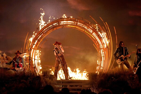 Lainey Wilson performs "Wildflowers and Wild Horses" at the 57th Annual CMA Awards on Wednesday, Nov. 8, 2023, at the Bridgestone Arena in Nashville, Tenn. (AP Photo/George Walker IV)