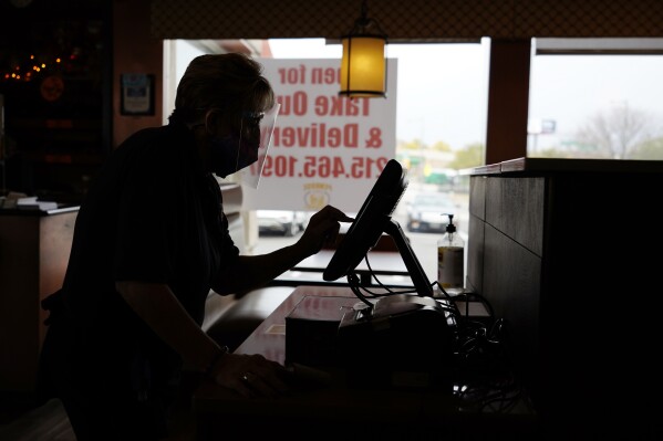 FILE - An order is entered by an employee at a diner on Nov. 17, 2020, in Philadelphia. It's never fun to be scammed, but if you're a small business owner falling for a scam can have long-lasting effects on a business, damaging client relationships and profit. (AP Photo/Matt Slocum, File)