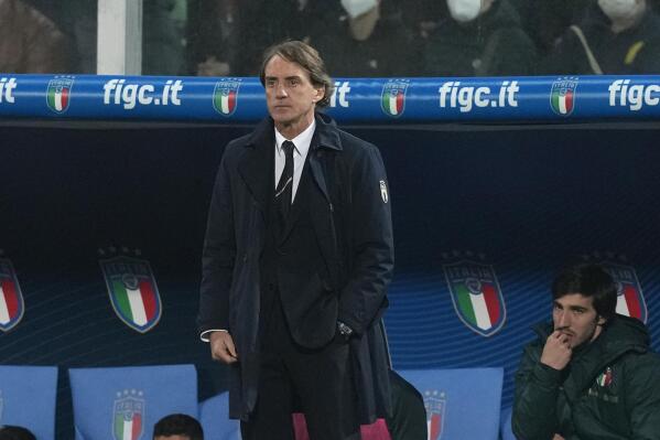 Italy's manager Roberto Mancini stands on the bench during the World Cup qualifying play-off soccer match between Italy and North Macedonia, at Renzo Barbera stadium, in Palermo, Italy, Thursday, March 24, 2022. North Macedonia won 1-0. (AP Photo/Antonio Calanni)