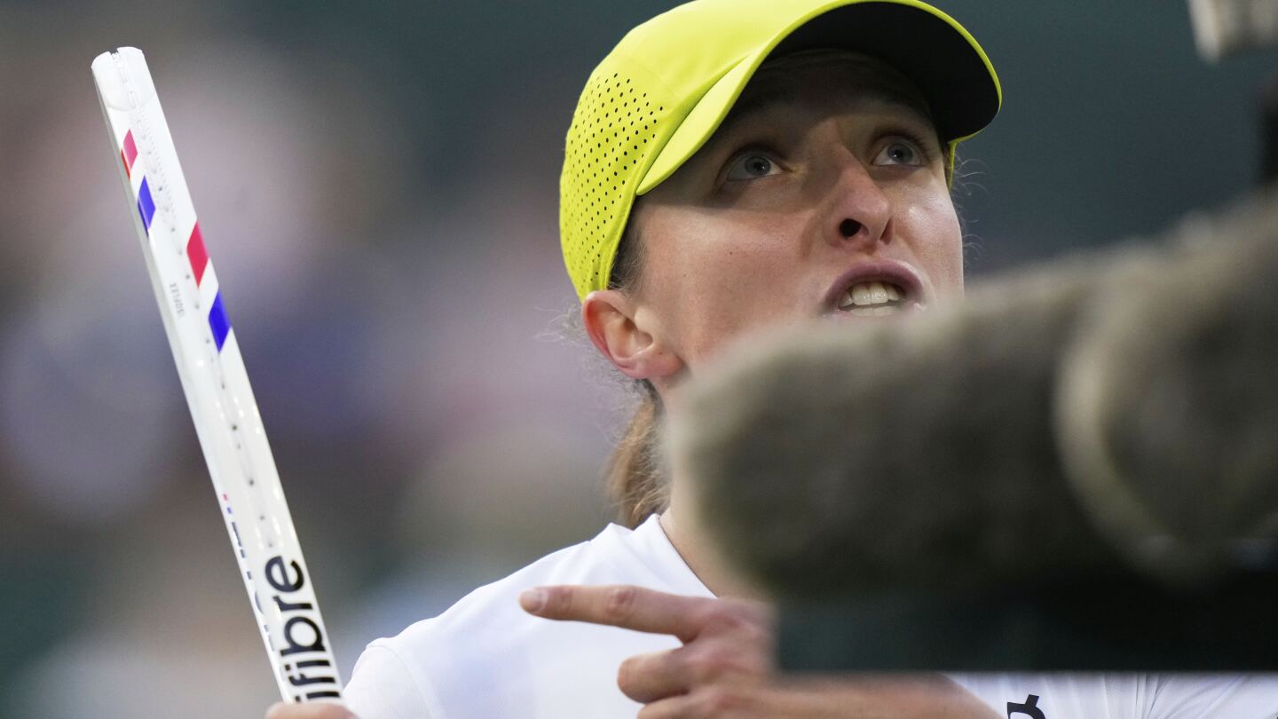 Iga Swiatek discusses nearly hitting a ball boy and three weeks she spent crying daily last year - The Associated Press