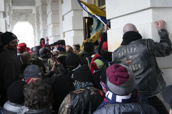 FILE - In this Jan. 6, 2021 file photo insurrectionists loyal to President Donald Trump try to open a door of the U.S. Capitol as they riot in Washington. New internal documents provided by former Facebook employee-turned-whistleblower Frances Haugen provide a rare glimpse into how the company, after years under the microscope for the policing of its platform, appears to have simply stumbled into the Jan. 6 riot (AP Photo/Jose Luis Magana, File)