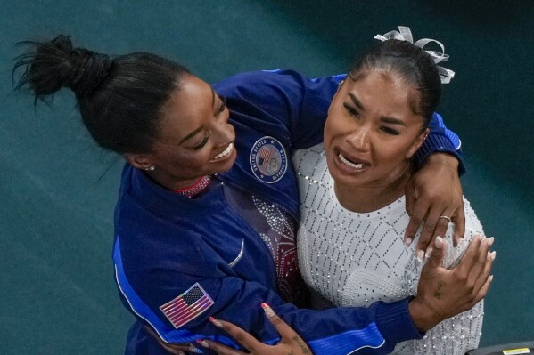 Jordan Chiles, of the United States, and Simone Biles, of the United States, celebrate after the women's artistic gymnastics individual floor finals in Bercy Arena at the 2024 Summer Olympics, Monday, Aug. 5, 2024, in Paris, France. Biles won the silver medal and Chiles the bronze medal. (AP Photo/Morry Gash)