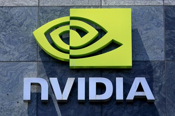 FILE - A sign for a Nvidia building is shown in Santa Clara, Calif., May 31, 2023. A lower stock price can actually be a boon for investors in some rare cases. When companies announce splits to their stocks, as Nvidia recently did, they have historically gone on to beat the broad market in the next year. Though a stock split doesn’t guarantee an ensuing rise in price. (AP Photo/Jeff Chiu, File)